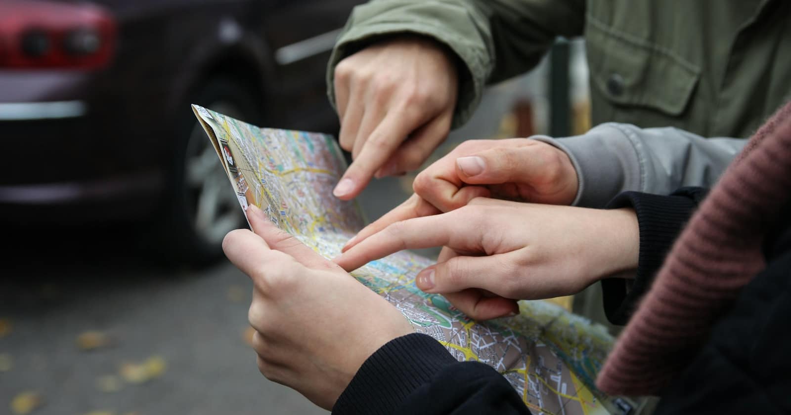 A phone showing a map while navigating a street