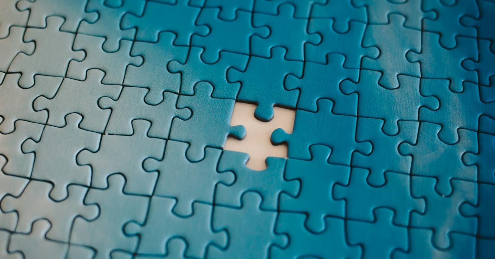 Jigsaw puzzle pieces being fitted together